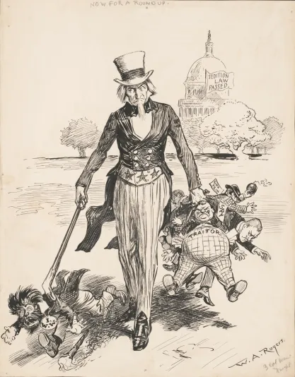 Drawing shows Uncle Sam rounding-up men labeled "Spy," "Traitor," "IWW," "Germ[an] money," and "Sinn Fein" with the United States Capitol in the background displaying a flag that states "Sedition law passed" referring to the Sedition Act of 1918.